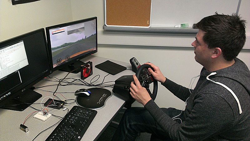 Driving simulator with a computer-controlled fan for simulating wind